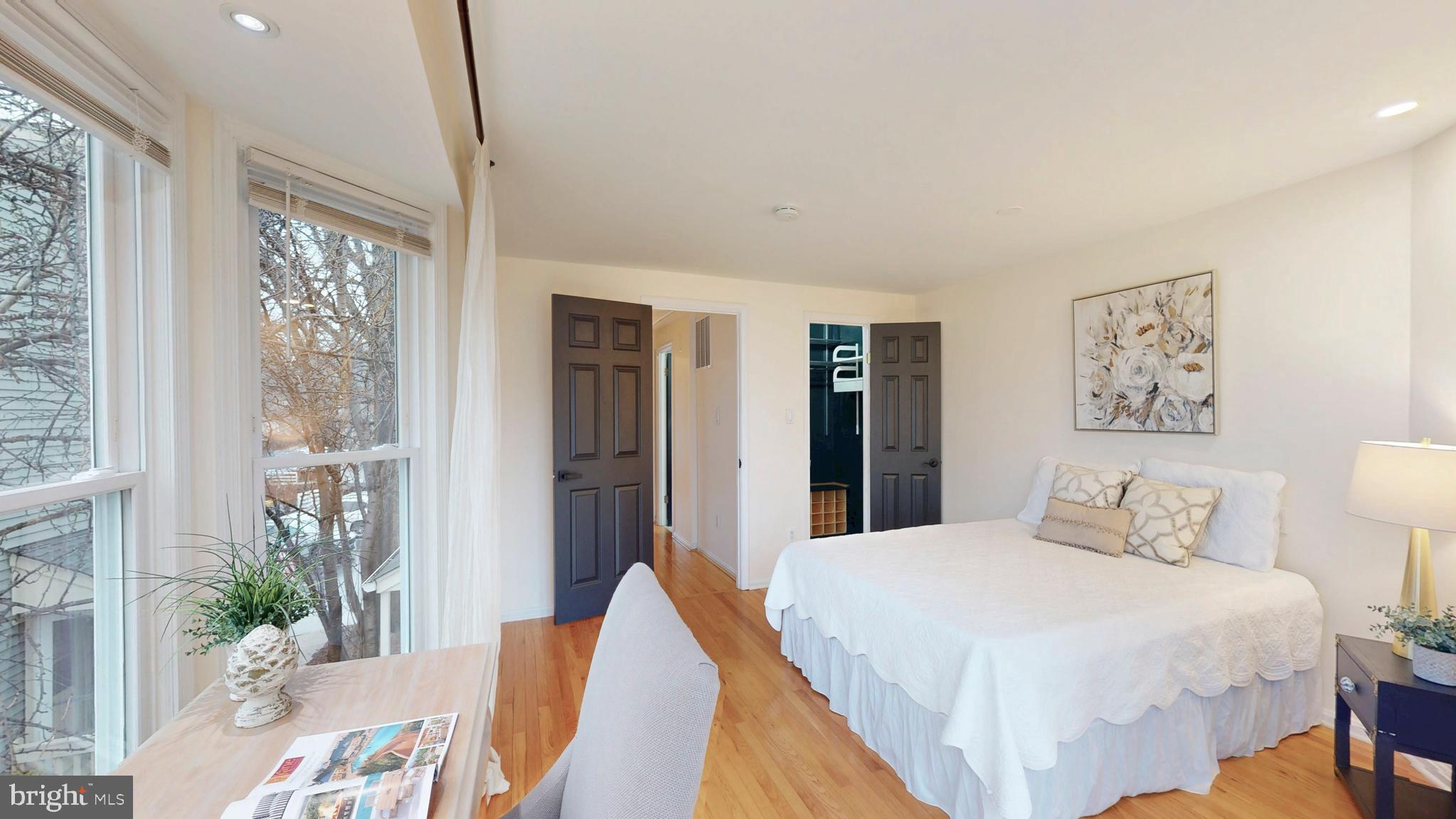 1771 Whisperhill Drive Reston, VA 20194 - Photo 24 of 44 a bedroom with a large bed and a chandelier
