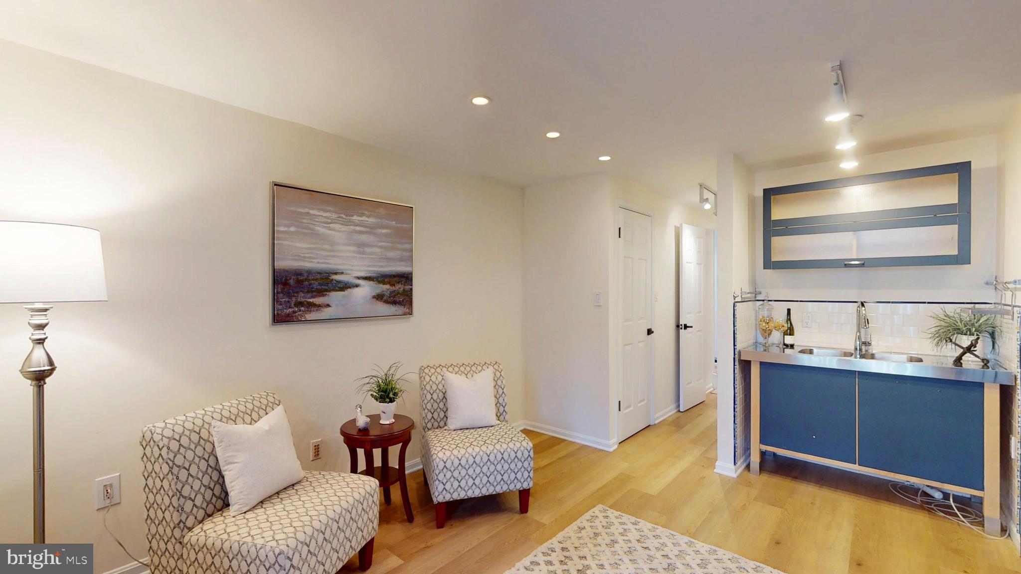 1771 Whisperhill Drive Reston, VA 20194 - Photo 36 of 44 a living room with furniture and a flat screen tv