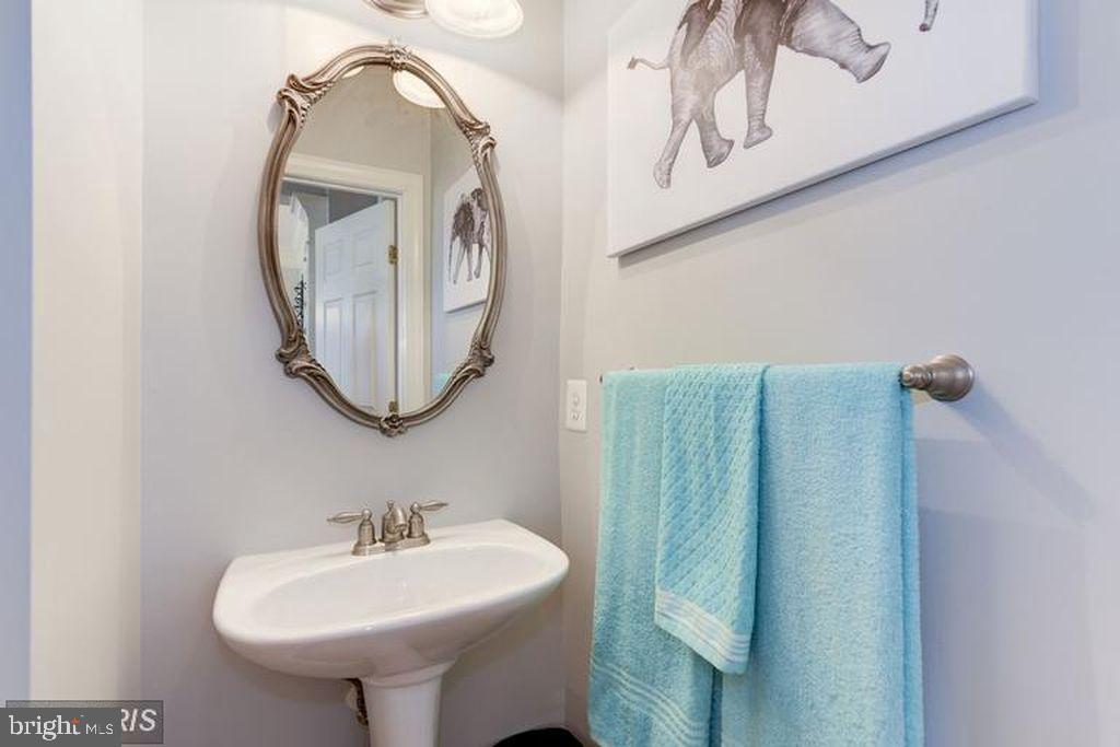 25259 Destination Square Aldie, VA 20105 - Photo 14 of 28 a bathroom with a sink mirror and toilet
