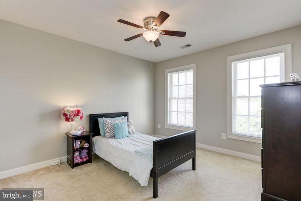 25259 Destination Square Aldie, VA 20105 - Photo 18 of 28 a bedroom with a bed and a window
