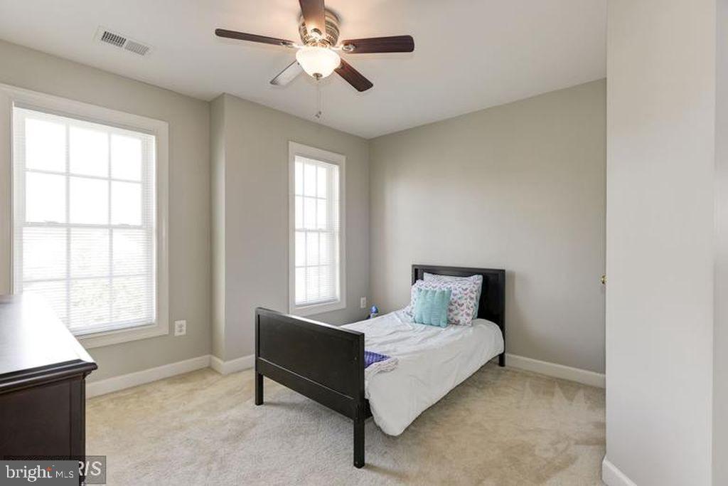25259 Destination Square Aldie, VA 20105 - Photo 19 of 28 a bedroom with a bed and window