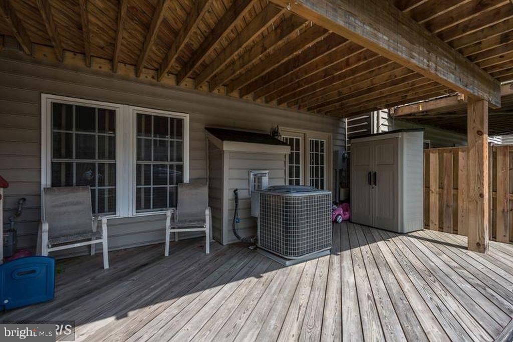 25259 Destination Square Aldie, VA 20105 - Photo 26 of 28 a view of a porch with wooden floor and stairs