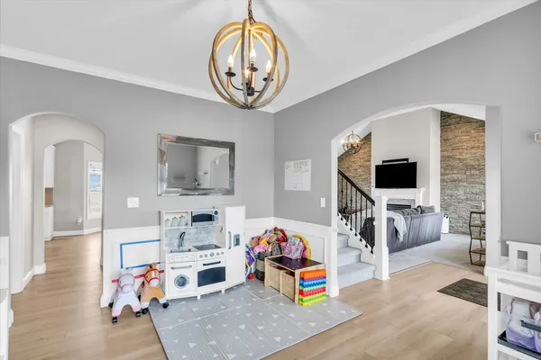 a view of a livingroom with furniture and a flat screen tv