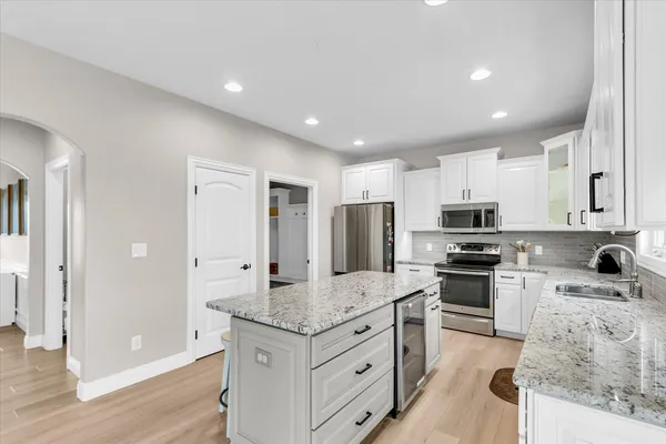 a kitchen with a table and chairs in it