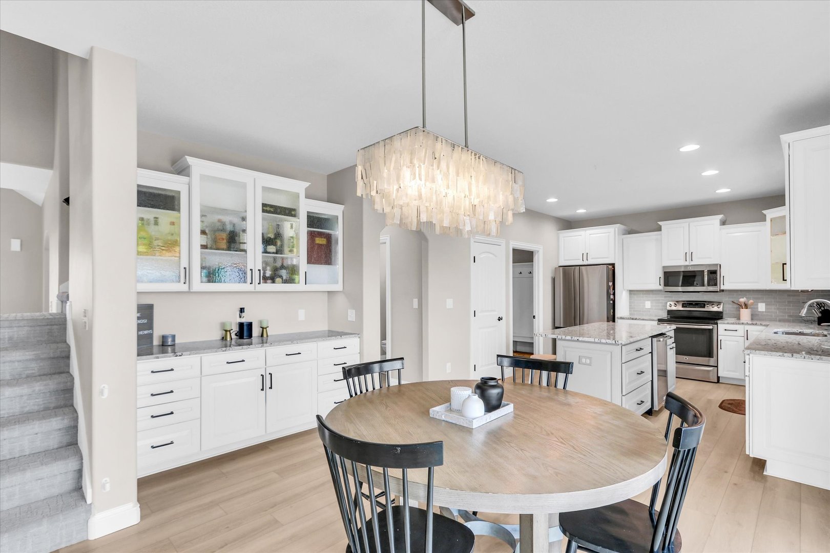 1010 Declaration Drive Savoy, IL 61874 - Photo 22 of 54 a large kitchen with a table and chairs