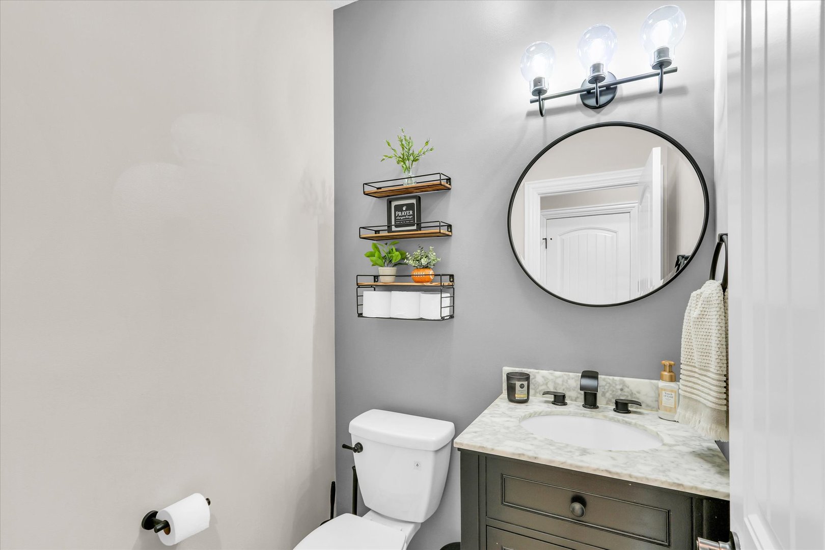1010 Declaration Drive Savoy, IL 61874 - Photo 24 of 54 a bathroom with a granite countertop toilet sink and mirror
