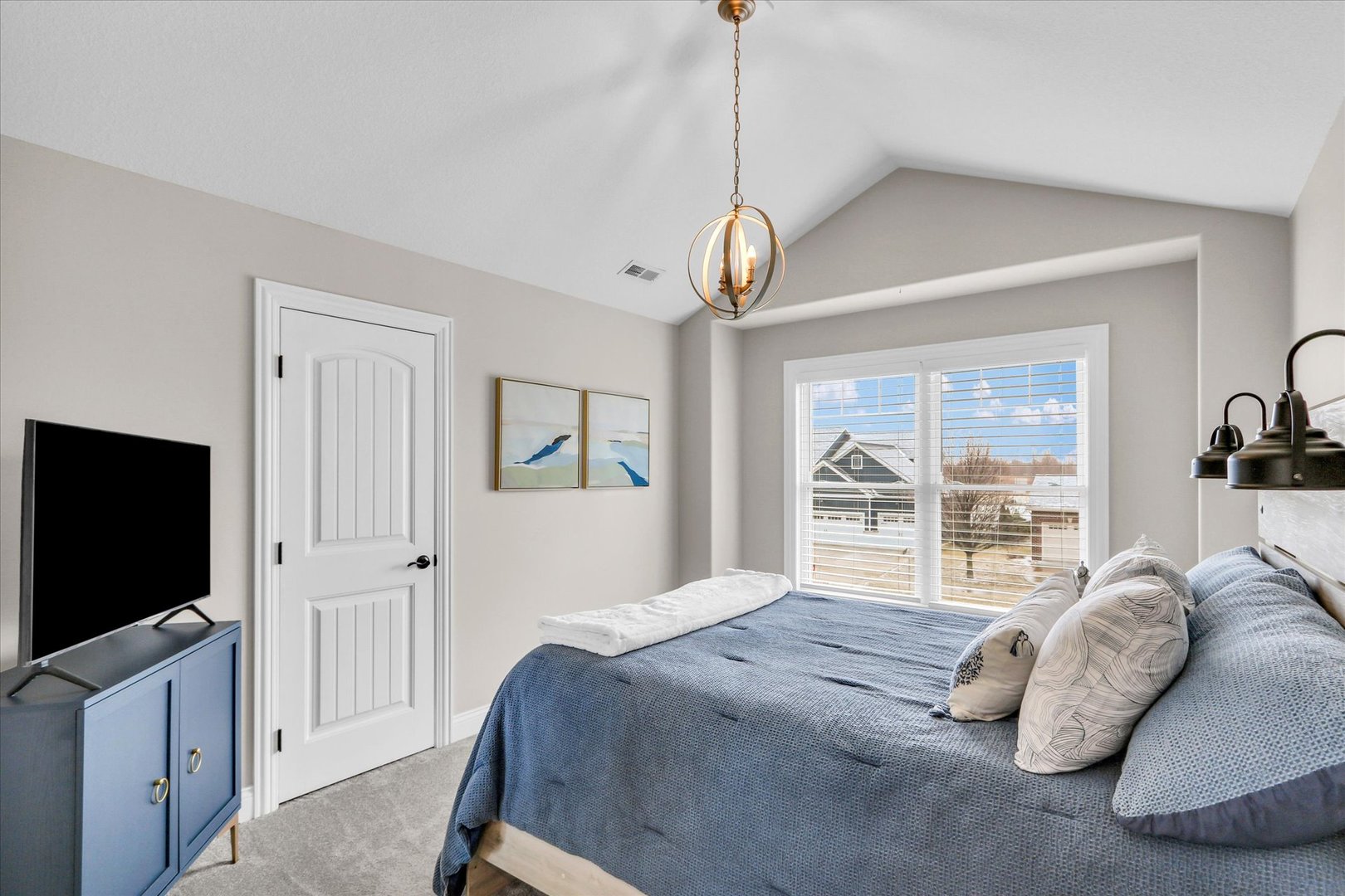 1010 Declaration Drive Savoy, IL 61874 - Photo 29 of 54 a spacious bedroom with a bed and a flat screen tv