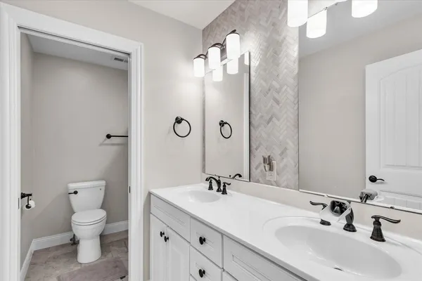 a bedroom with a bed and ceiling fan