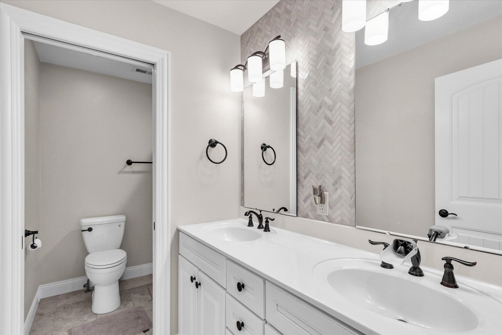 1010 Declaration Drive Savoy, IL 61874 - Photo 31 of 54 a bathroom with a sink double vanity and a mirror