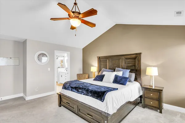 a bathroom with a sink a mirror a vanity and shower