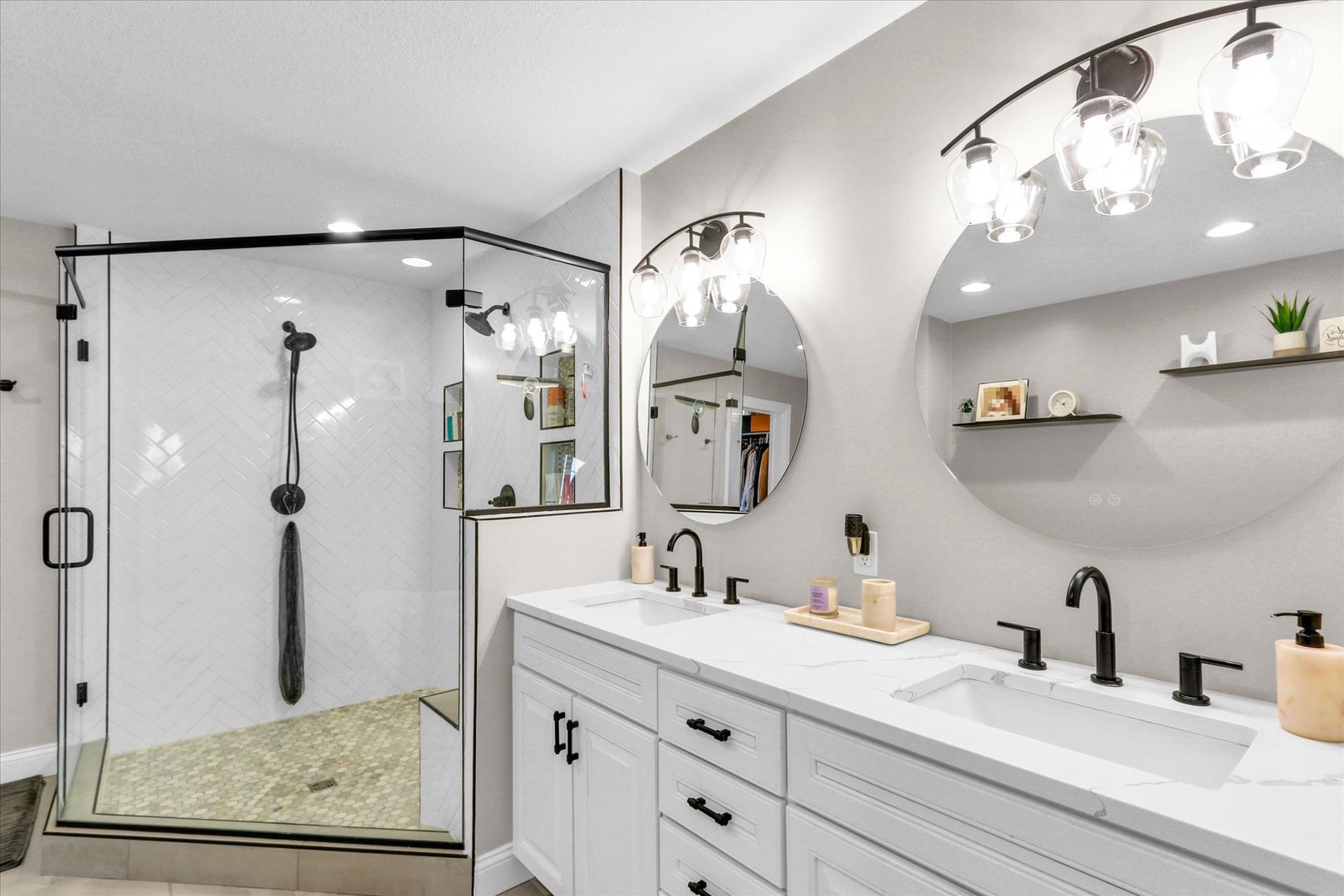 1010 Declaration Drive Savoy, IL 61874 - Photo 36 of 54 a bathroom with a sink a mirror a vanity and shower