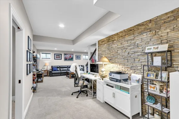 a view of a dining room with furniture and chandelier