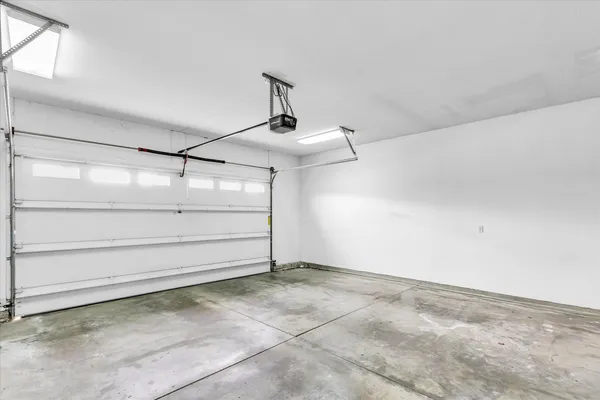 a view of a terrace with lawn chairs