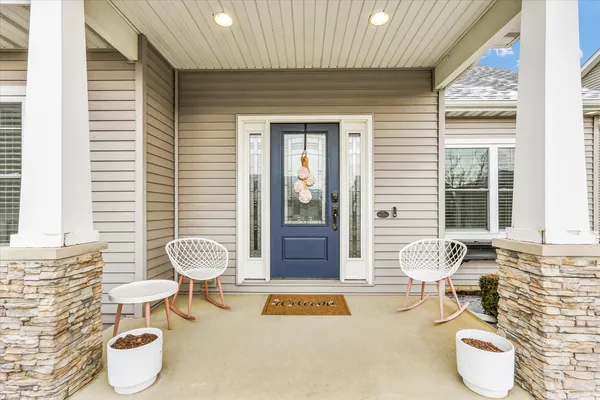 a bathroom with a toilet a sink and a window