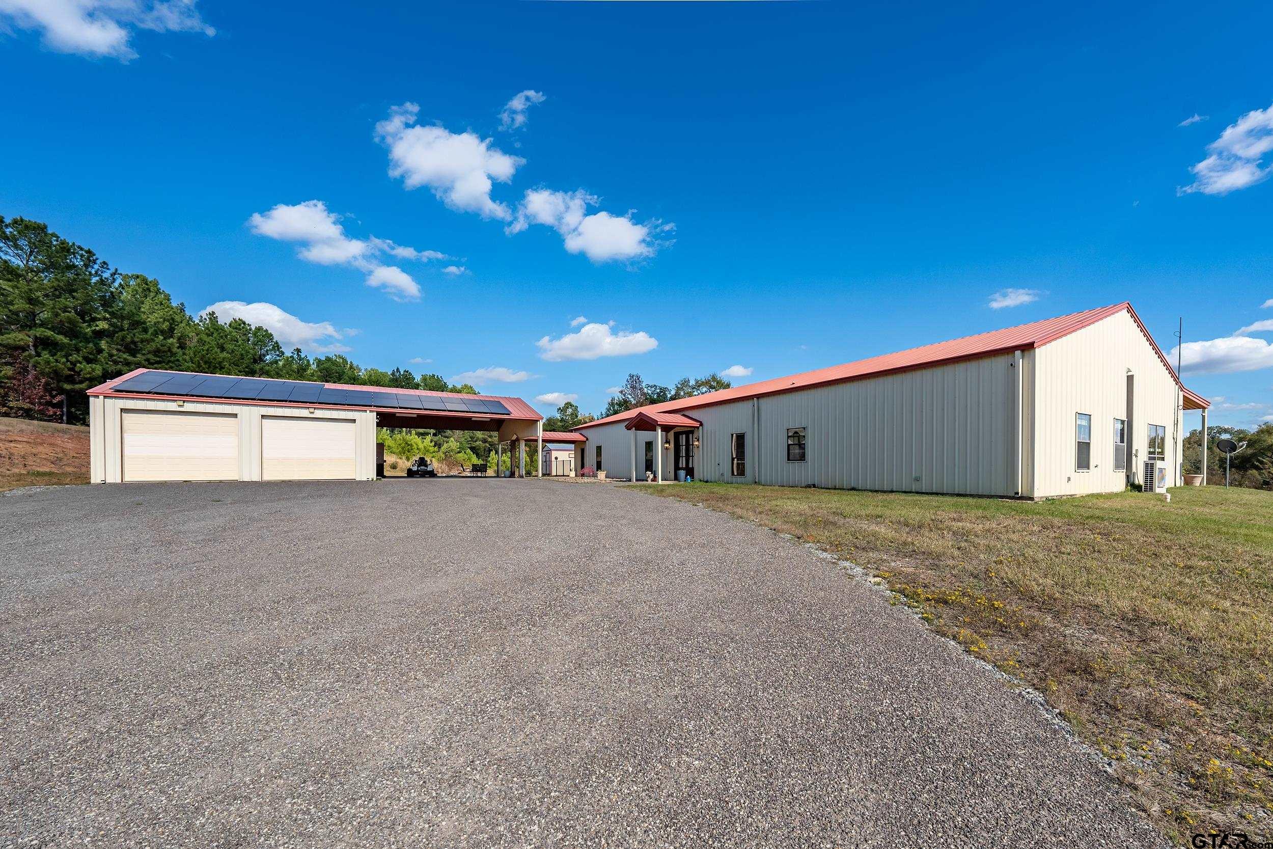 2600 Van Meter Road Kilgore, TX 75662 - Photo 2 of 48 a view of a house with a big yard and large tree