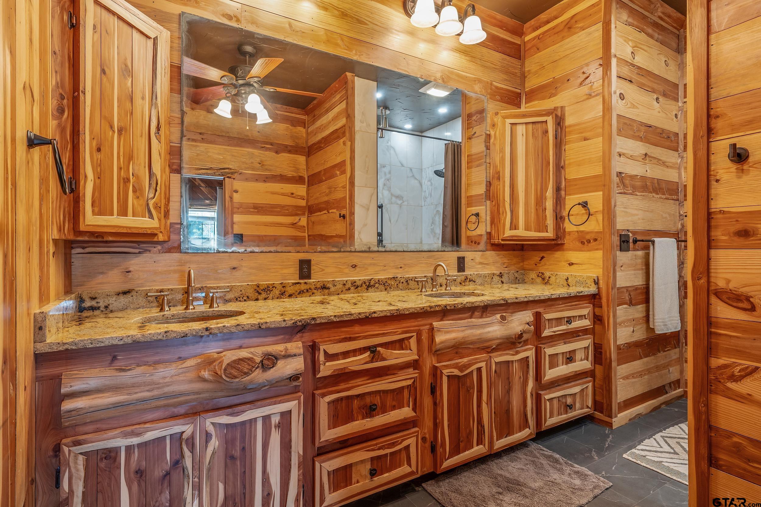 2600 Van Meter Road Kilgore, TX 75662 - Photo 21 of 48 a bathroom with a sink and a mirror