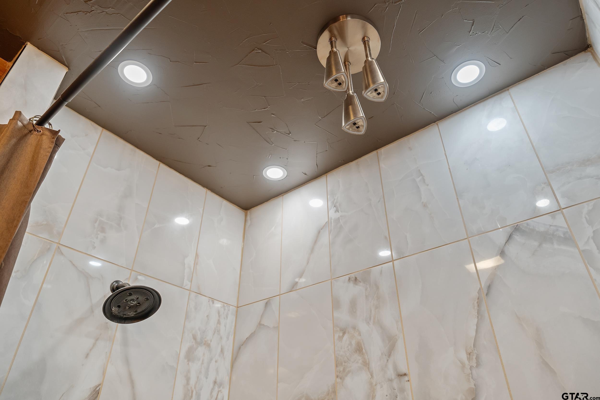 2600 Van Meter Road Kilgore, TX 75662 - Photo 24 of 48 a bathroom with a mirror and a shower