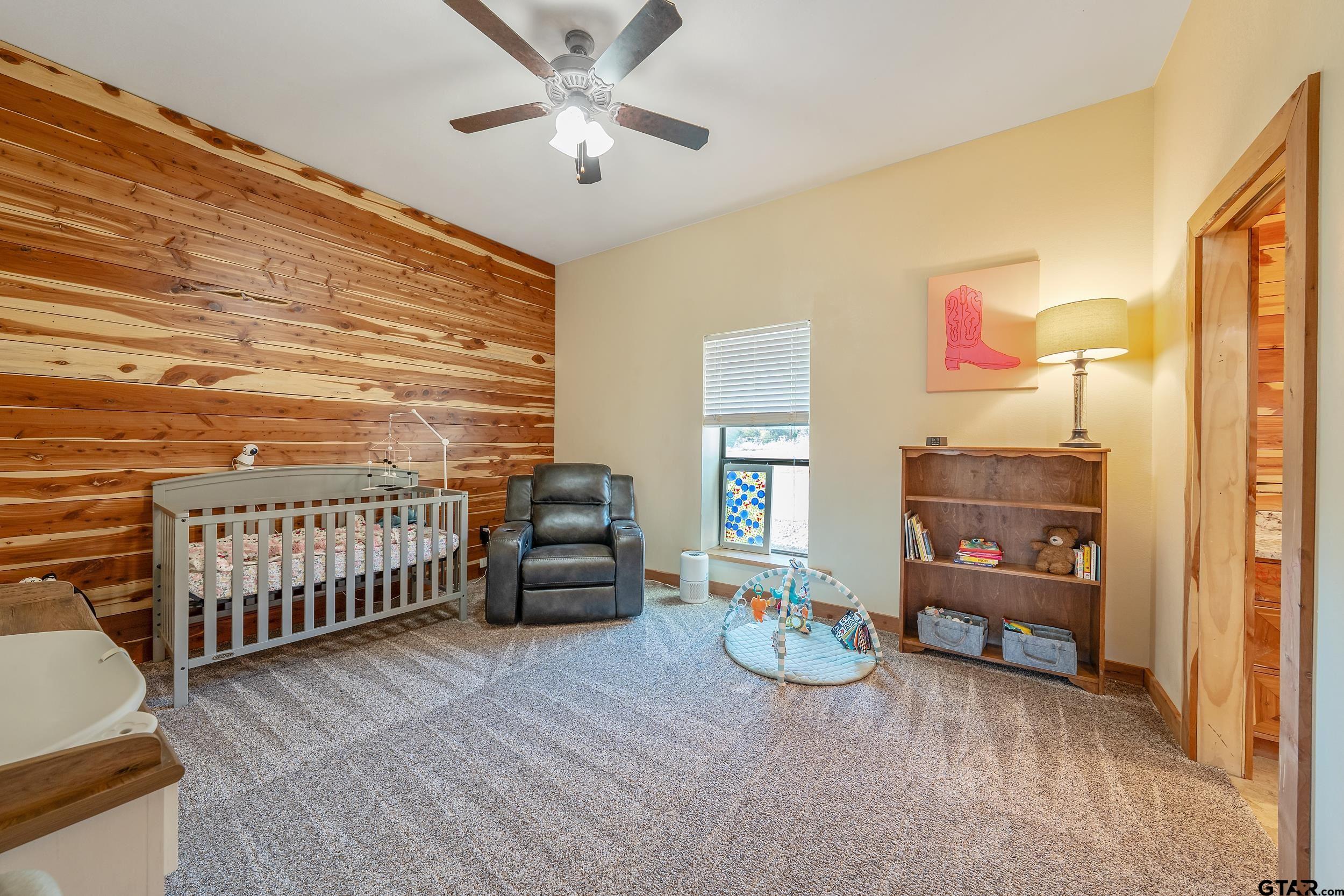 2600 Van Meter Road Kilgore, TX 75662 - Photo 27 of 48 a bedroom with furniture and a window