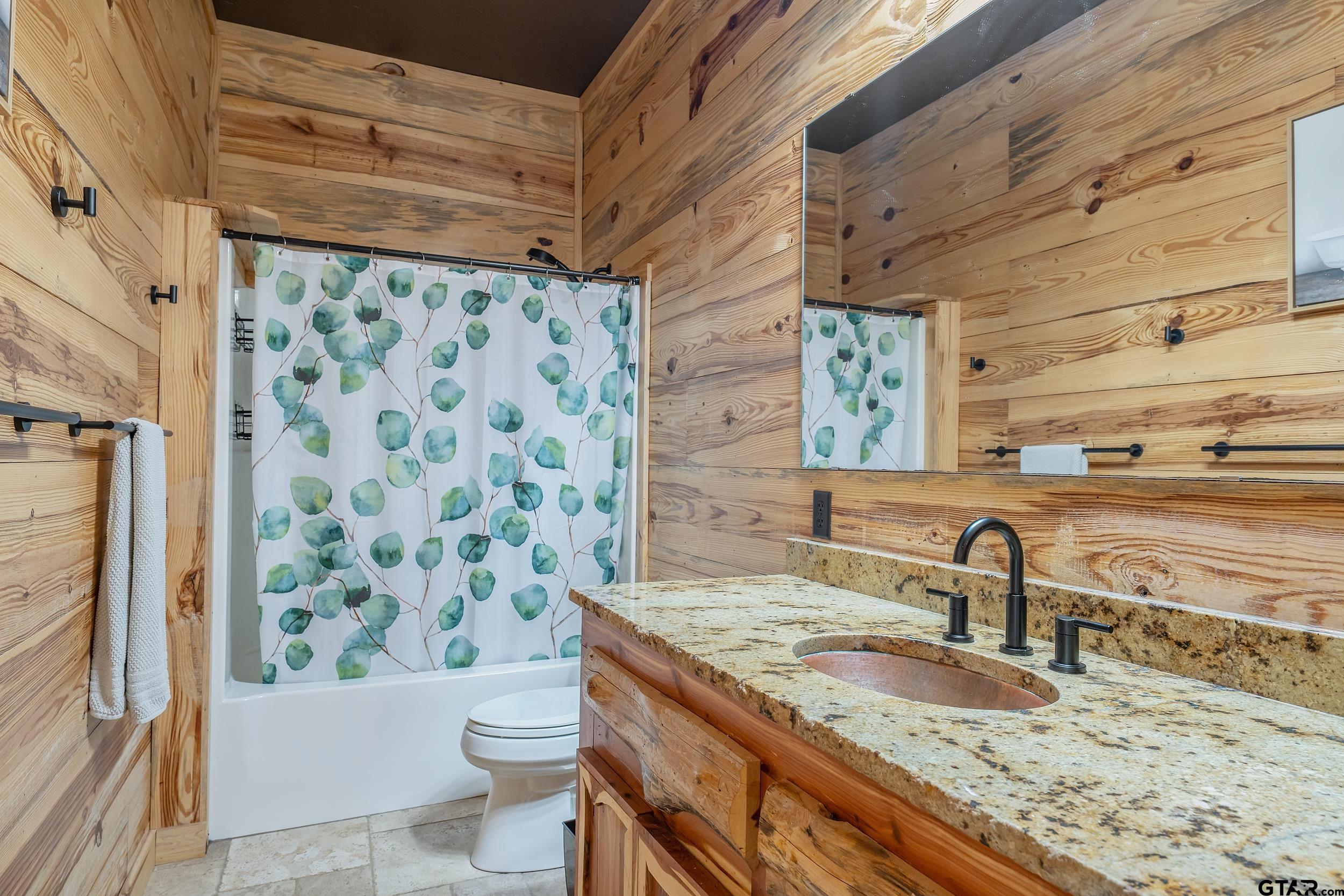2600 Van Meter Road Kilgore, TX 75662 - Photo 29 of 48 a bathroom with a granite countertop sink toilet and shower