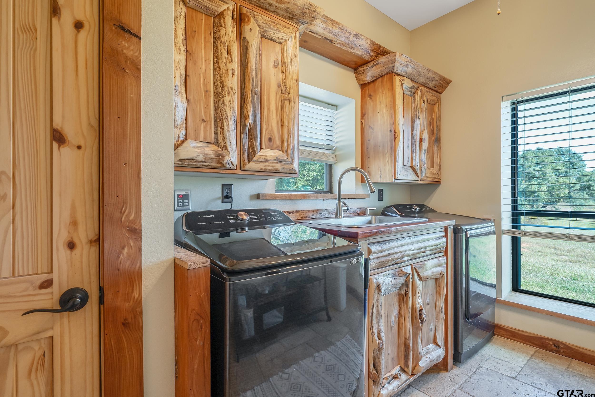 2600 Van Meter Road Kilgore, TX 75662 - Photo 41 of 48 a kitchen with a sink stove and cabinets