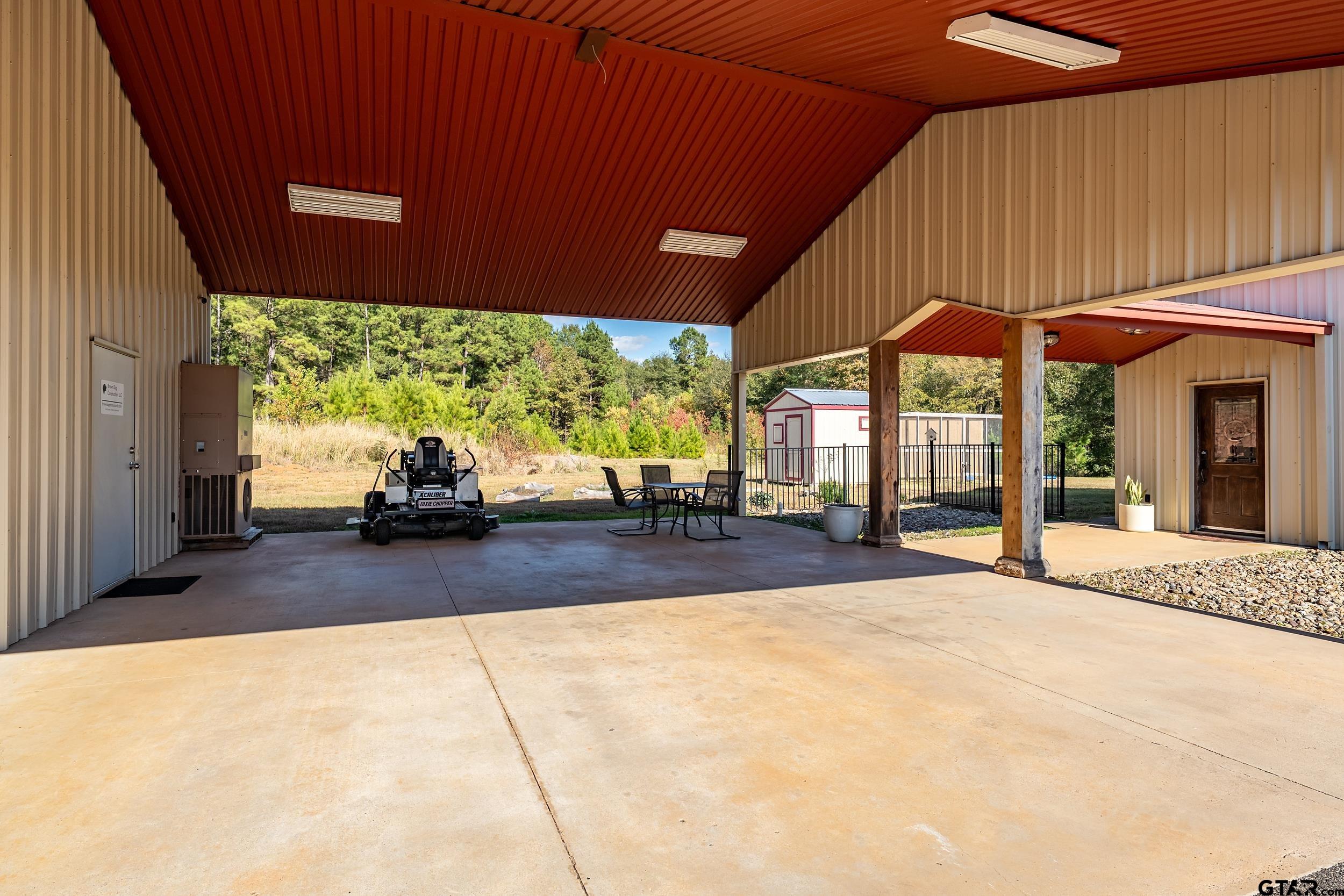 2600 Van Meter Road Kilgore, TX 75662 - Photo 42 of 48 a view of a porch with furniture and a backyard