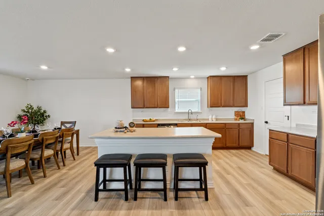 a kitchen with a table and chairs in it