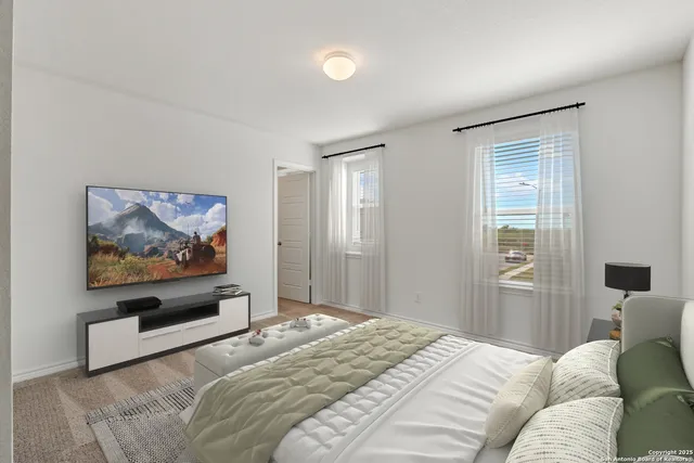 a bedroom with a bed and a painting on the wall