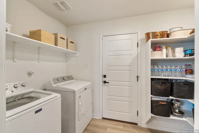 a storage room with washer and dryer