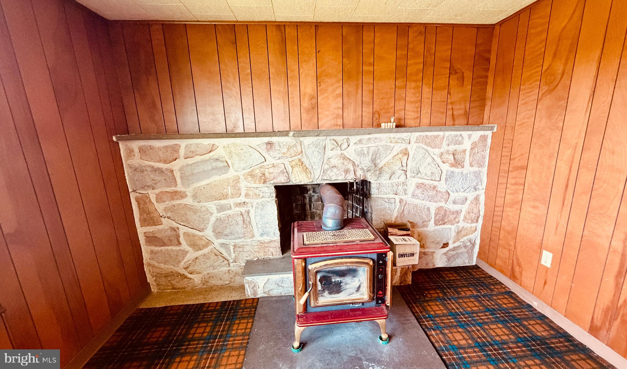1708 County Line Road Bechtelsville, PA 19505 - Photo 10 of 17 Den with wood burning stove