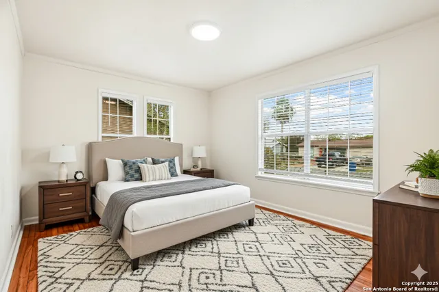 a bedroom with a bed and a dresser