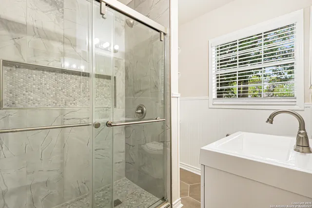 a bathroom with a sink and a shower