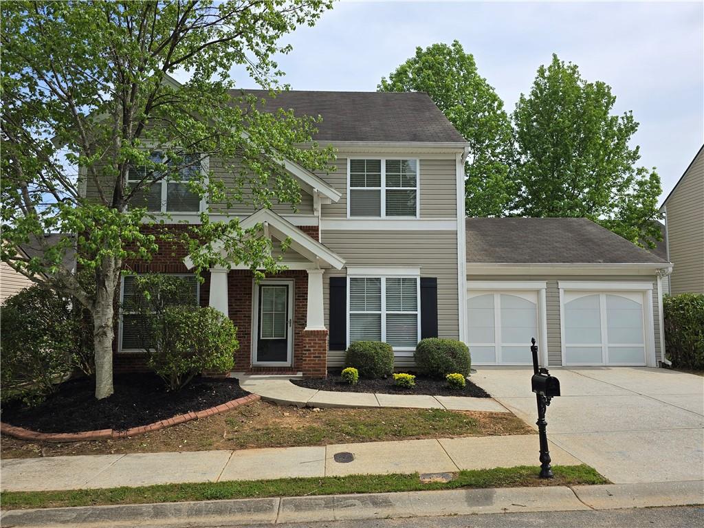 121 Oleander Way Canton, GA 30114 - Photo 1 of 1 a front view of a house with garden