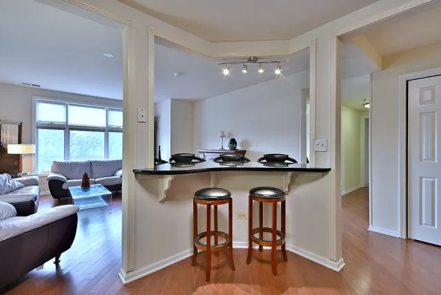 a open kitchen with a table and chairs