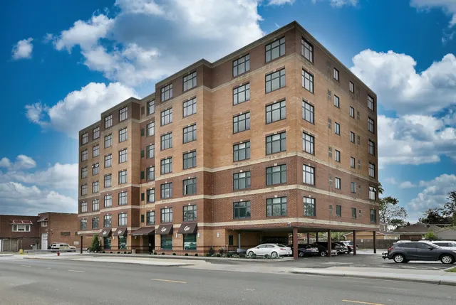 a tall building sitting on the side of a street