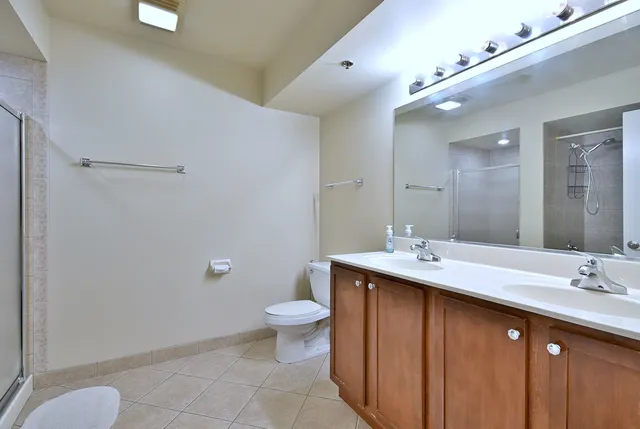 a bathroom with a sink toilet and mirror
