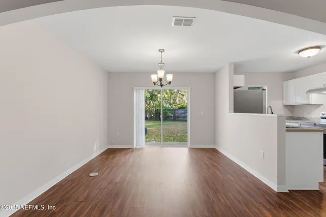 a kitchen with stainless steel appliances granite countertop a stove and a sink