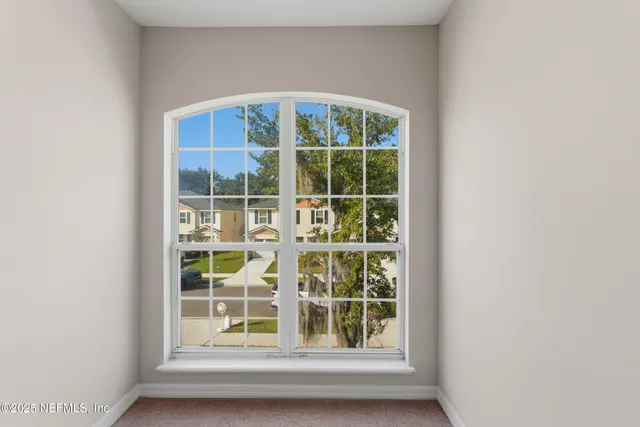 a view of a backyard with large trees