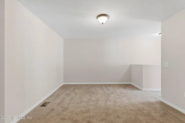 a view of backyard with green space