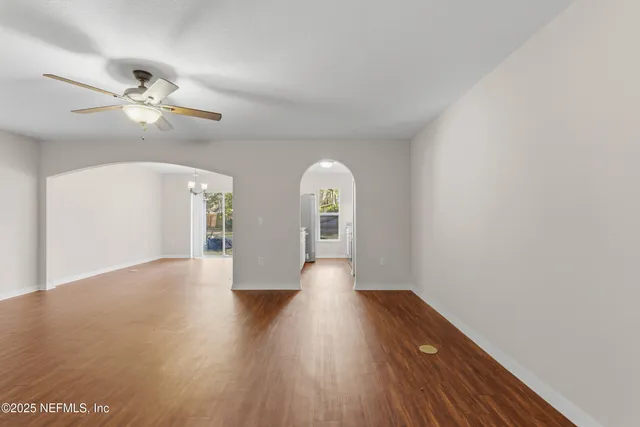 a view of an empty room with a bathroom
