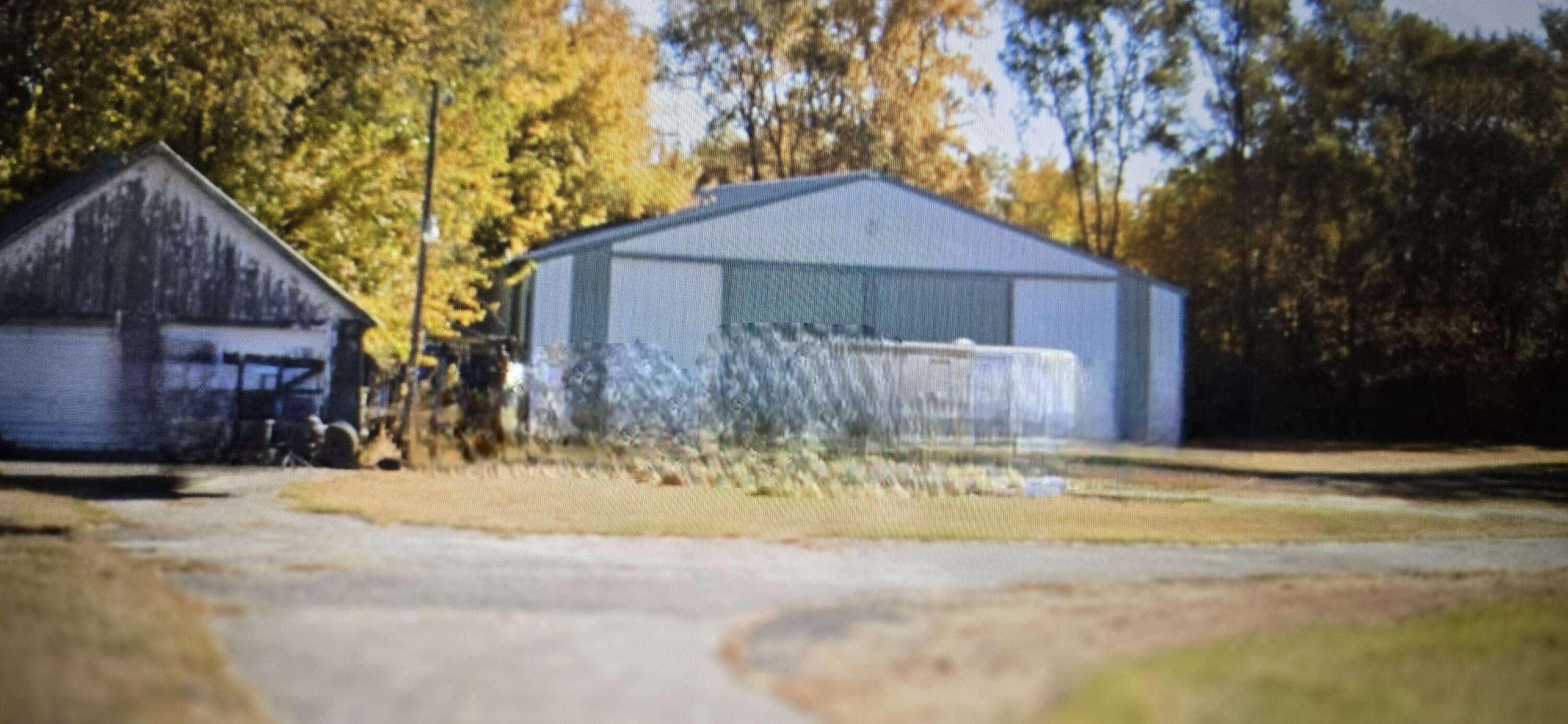 1103 Highway 41 Morocco, IN 47963 - Photo 3 of 8 a front view of a house with a yard