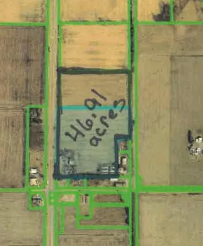 a view of a table and chairs in backyard