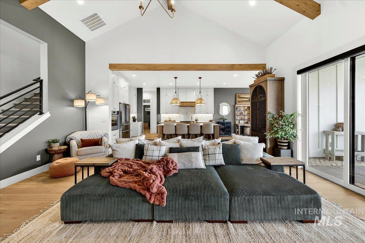 24853 Haflinger Way Middleton, ID 83644 - Photo 11 of 49 Living room with light wood-style flooring and suspended lighting