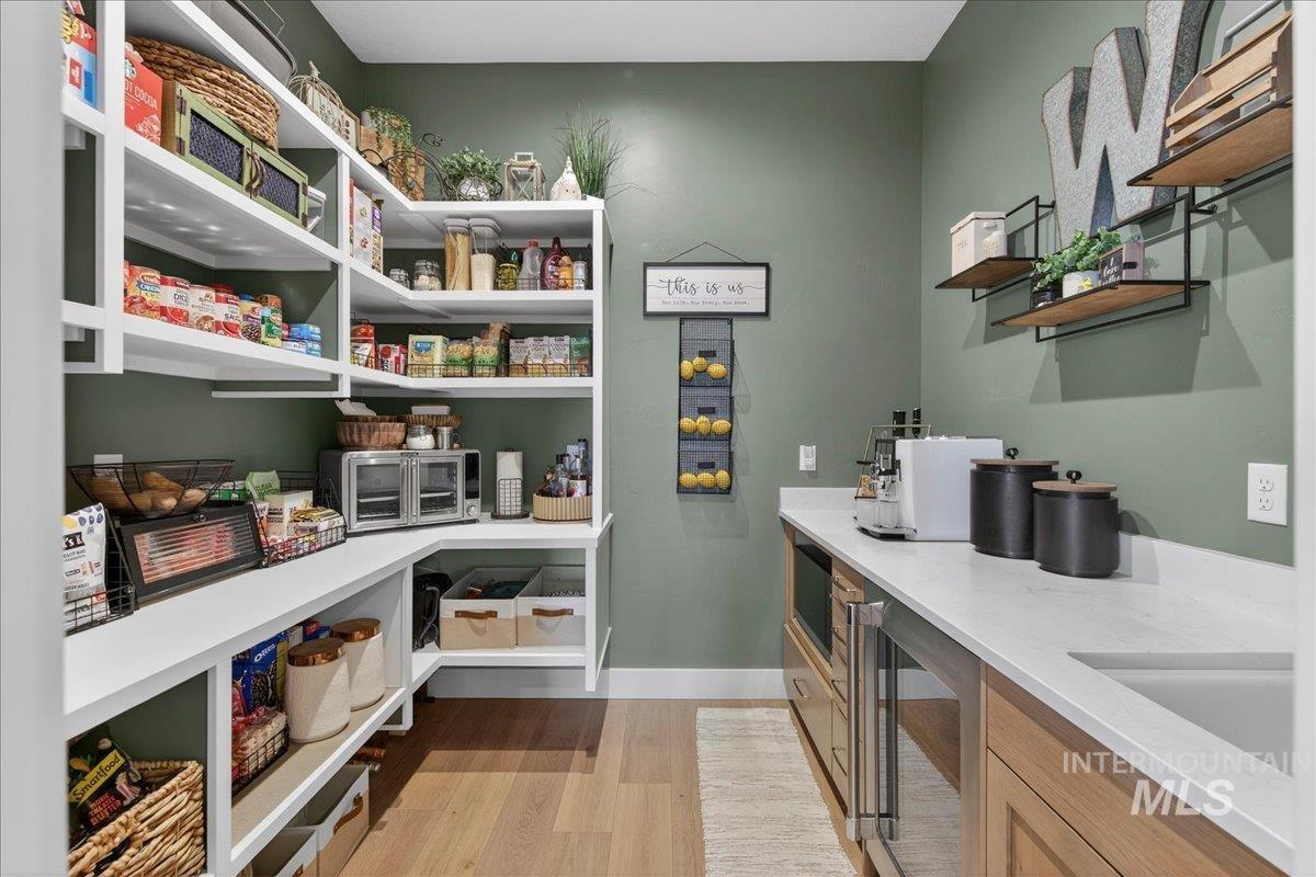 24853 Haflinger Way Middleton, ID 83644 - Photo 19 of 49 Storage area featuring beverage cooler and a sink