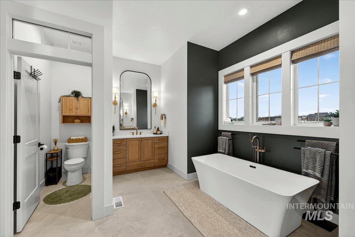 24853 Haflinger Way Middleton, ID 83644 - Photo 25 of 49 Bathroom featuring vanity and a freestanding tub