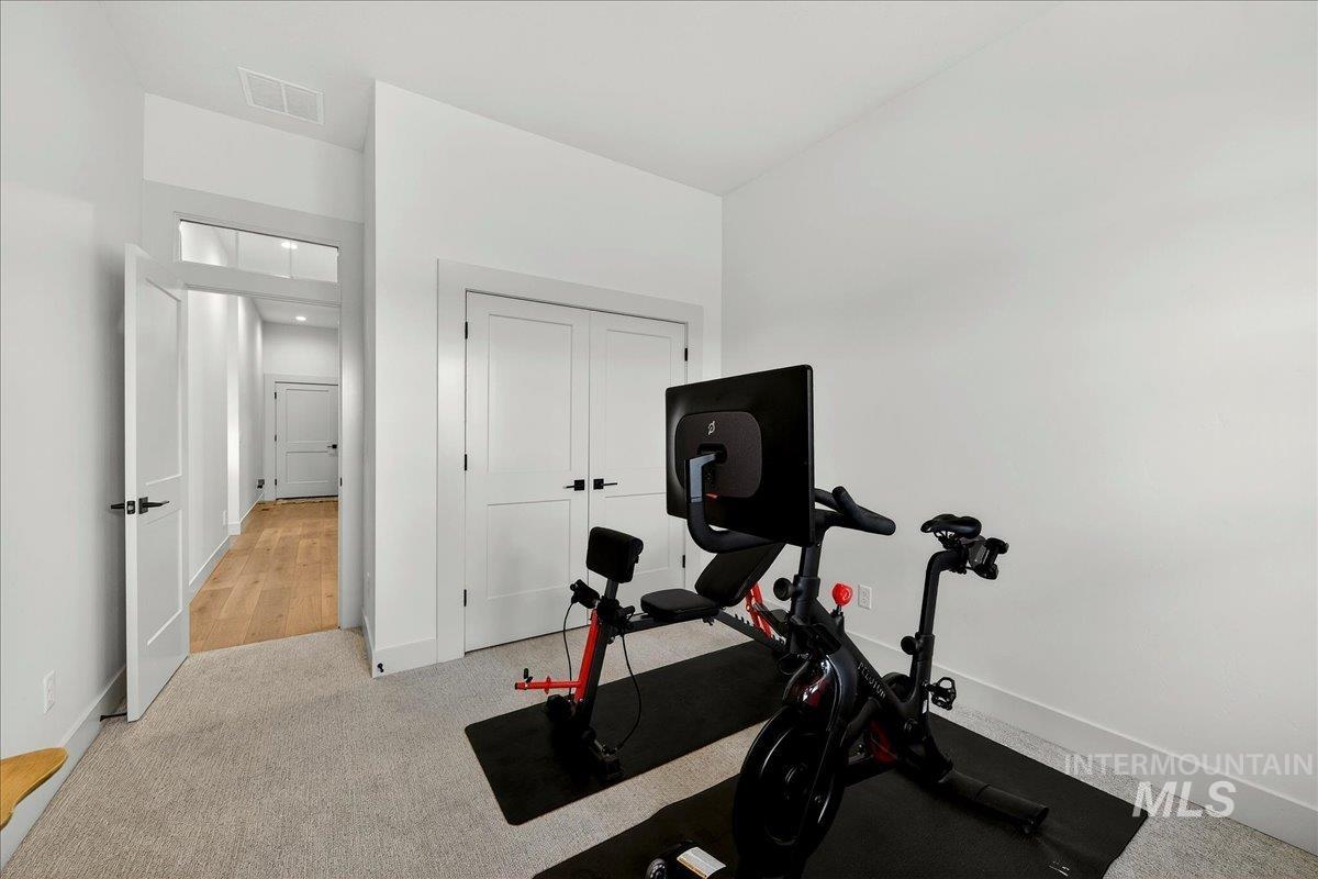 24853 Haflinger Way Middleton, ID 83644 - Photo 35 of 49 Exercise room with light colored carpet