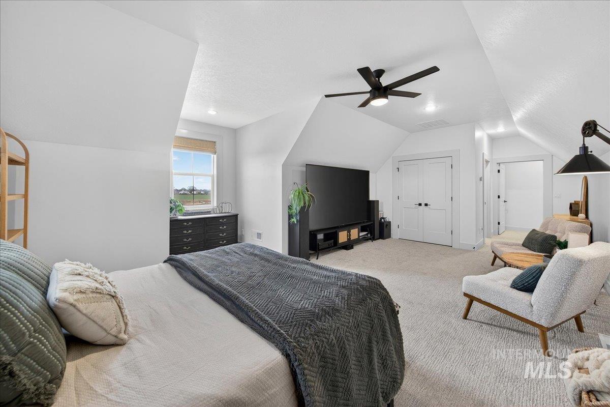 24853 Haflinger Way Middleton, ID 83644 - Photo 38 of 49 Carpeted bedroom featuring a ceiling fan and a closet