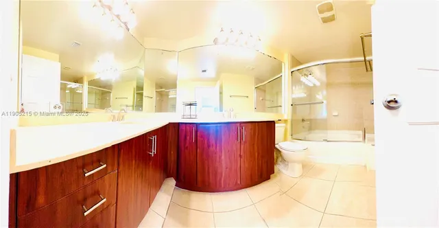 a bathroom with a mirror and a shower