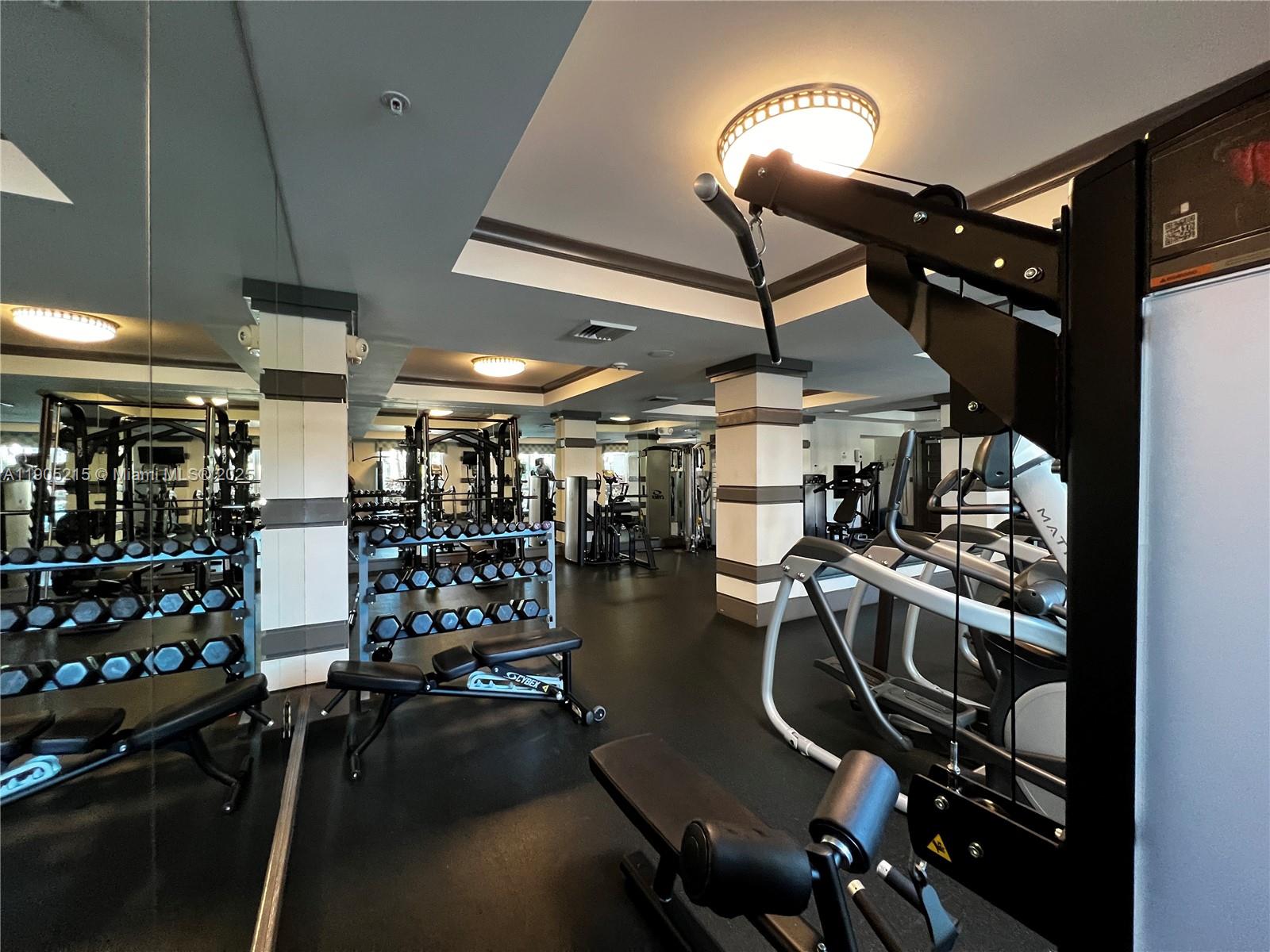 2421 Northeast 65th Street, Unit 506 Fort Lauderdale, FL 33308 - Photo 47 of 59 a view of a room with gym equipment