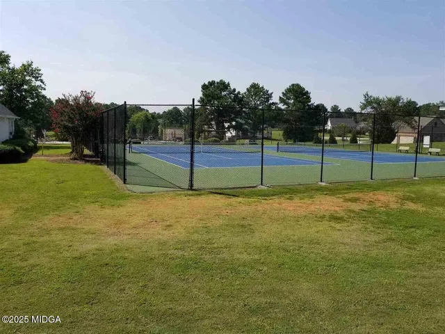 a view of yard with tall trees