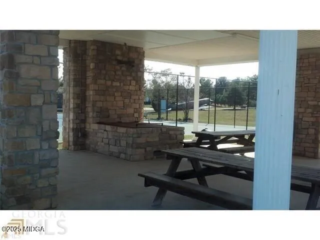 a kitchen view with table and chairs